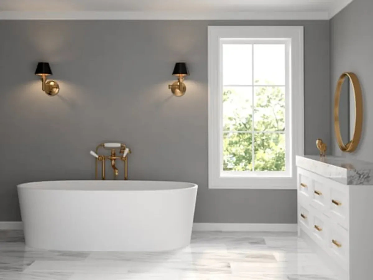 Remodelled bathroom with freestanding soaking tub, marble tile floor and brass fixtures in a Big Bear mountain home