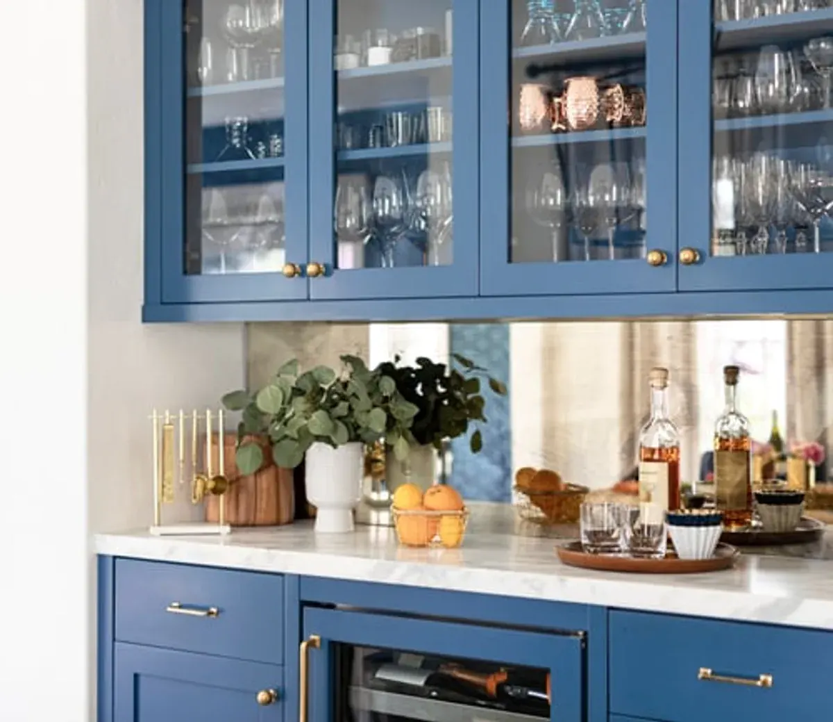 Renovated mountain home kitchen with stone counters, custom cabinetry and warm wood finishes
